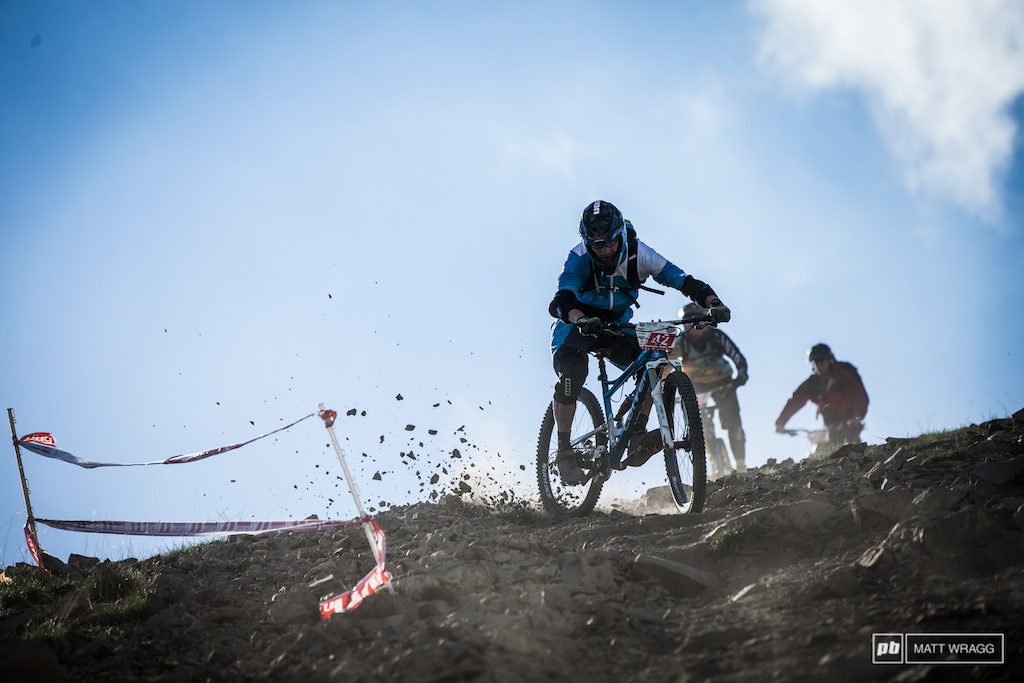 Out of the start gate riders sprinted down a stretch of fireroad through the steep rocks and into a balls-to-the-wall flatout blast down the crest. Max Schumann getting a bit loose on his practice run.