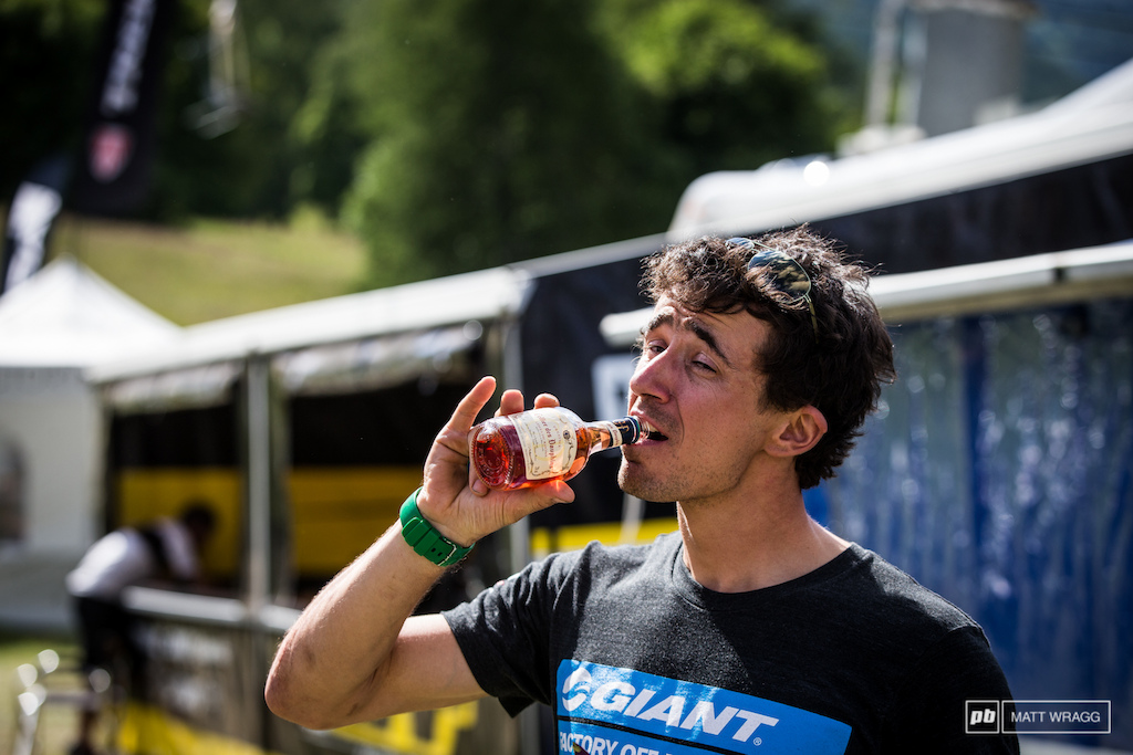 Adam Craig is a Real Man. You have to be to wander round the pits drinking pink wine...