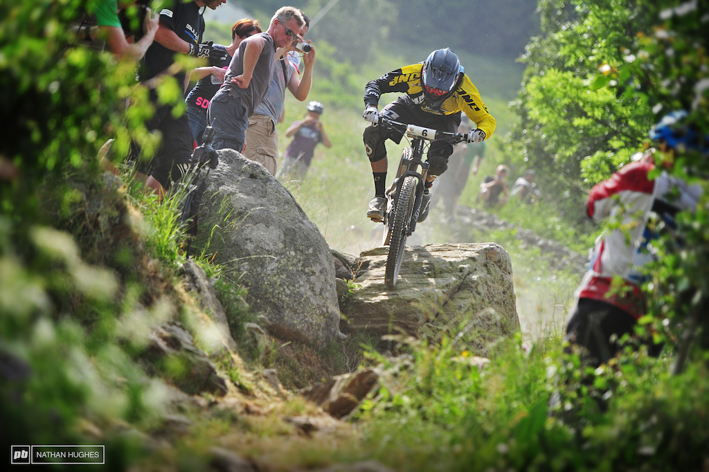 There's plenty of riders pushing the envelope on the enduro circuit, but Dan Atherton remains one of the most exciting to watch. Second place in the last two stages is the proof he's just for show, however. Here he takes the straight line over the boulders into... well, other boulders.