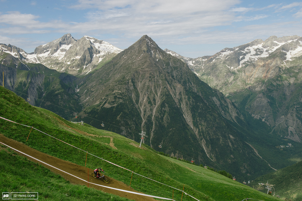 Guillaume Cauvin man handeling the turn after a massive road gap. Might I add again, the views here are epic..