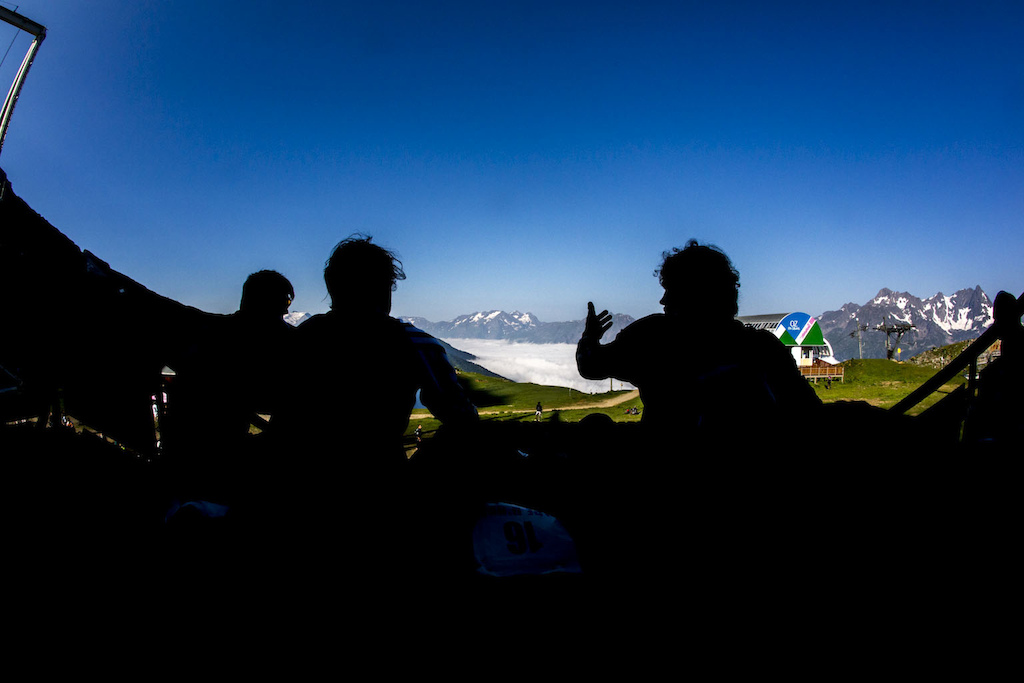UK boys sitting on the top spot the panoramic view over the French Alps.