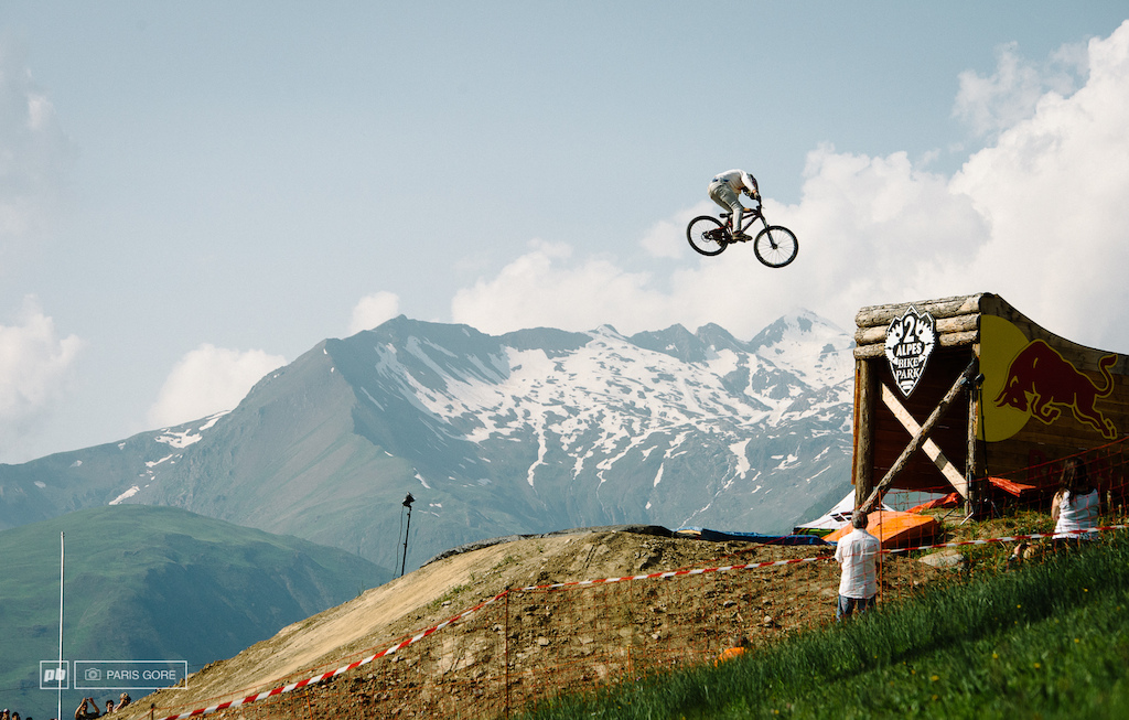 Martin Soderstrom spins off the whale tale high over the the same mountain that is holding the mega avalanche this weekend.