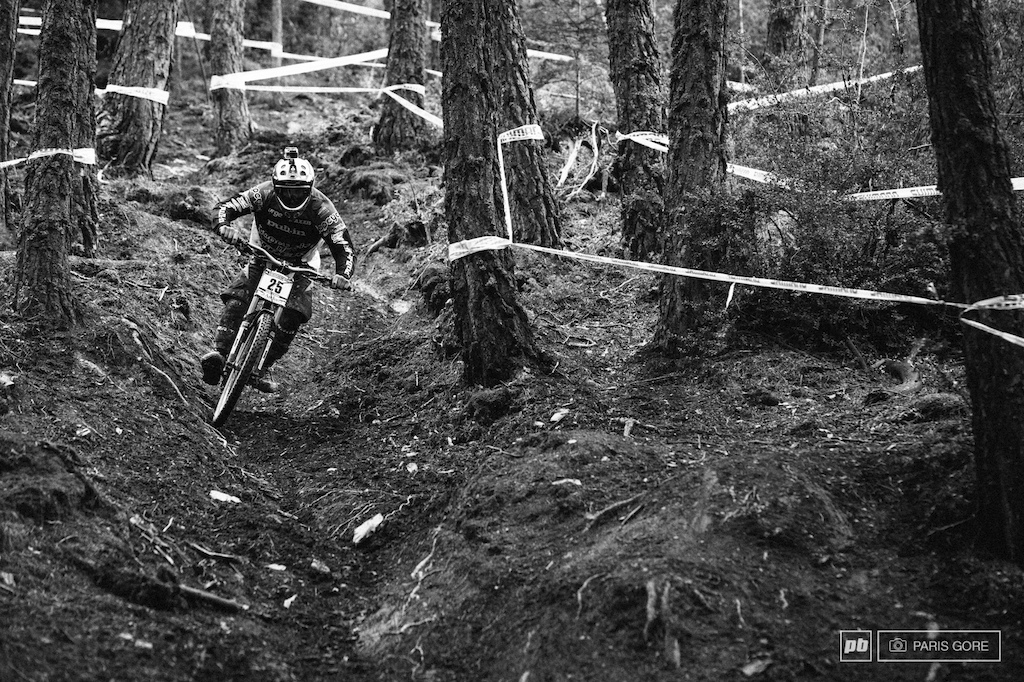 Aurelien Giordanengo ping ponging through the trees in the mid section of the course.