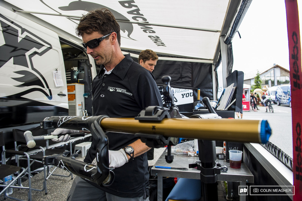 Mark Fitzsimmons putting the mechanic s favorite tool--a hammer any kind of hammer--to work in the Fox Racing Shox pits after the day s practice.