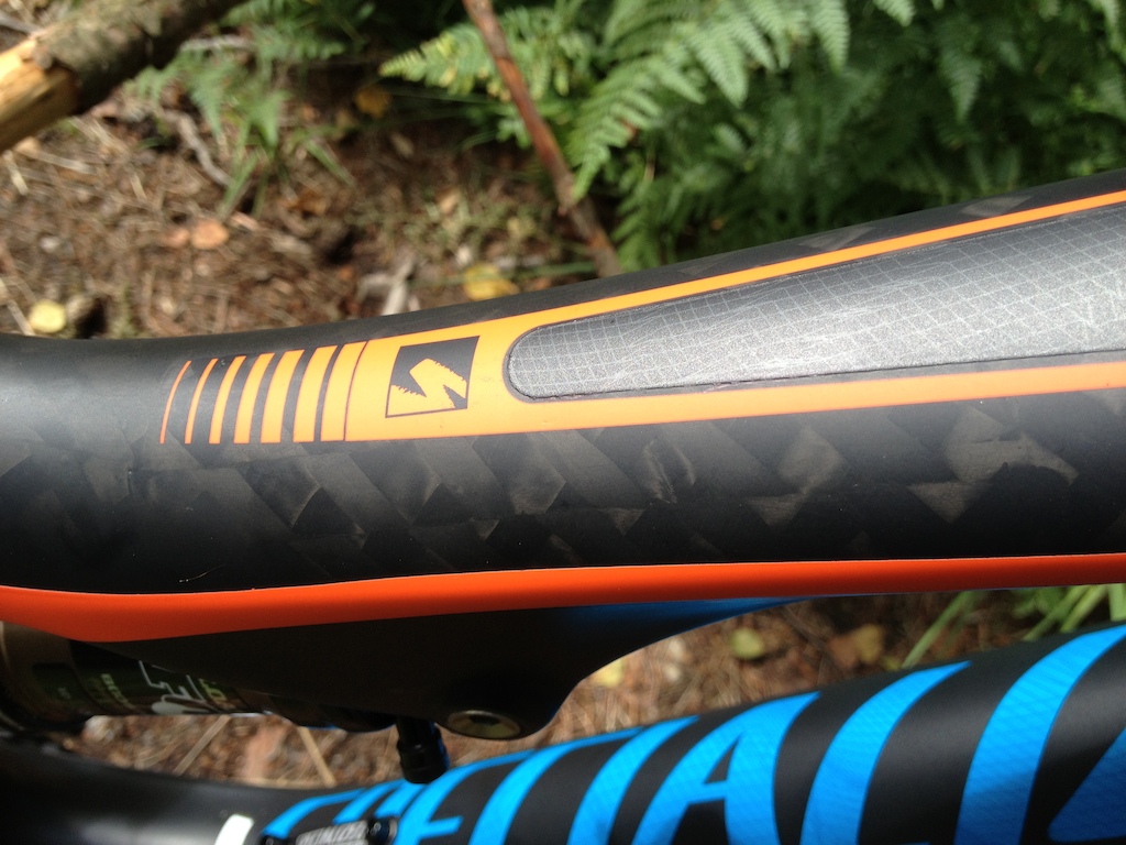 Specialized Stumpjumper Expert Evo Carbon. Close up of detailing on top tube with exposed wide weave carbon.... nom nom!!