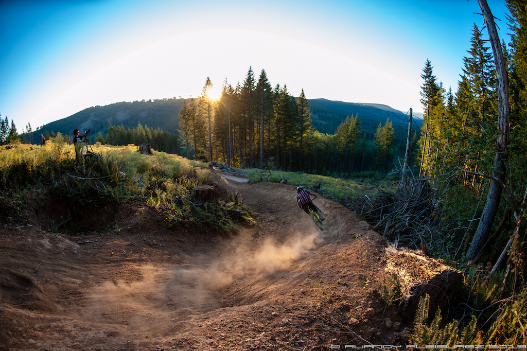 Little brother filming his older brother railing this steep S berm.