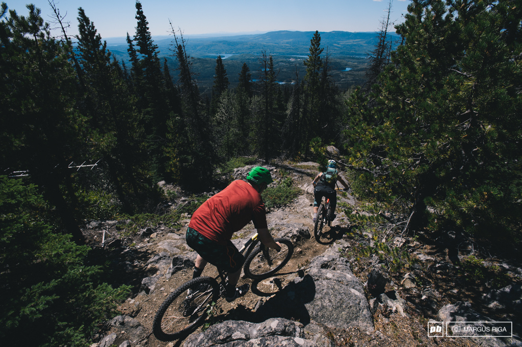 Riley McIntosh and Meg Broswick pick their way down the rocks right off the very top of Boer Mountain Burns Lake BC.