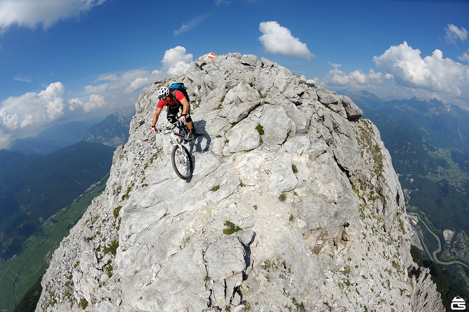 Tibor rides off a very exposed mountain summit in Tirol, Austria.