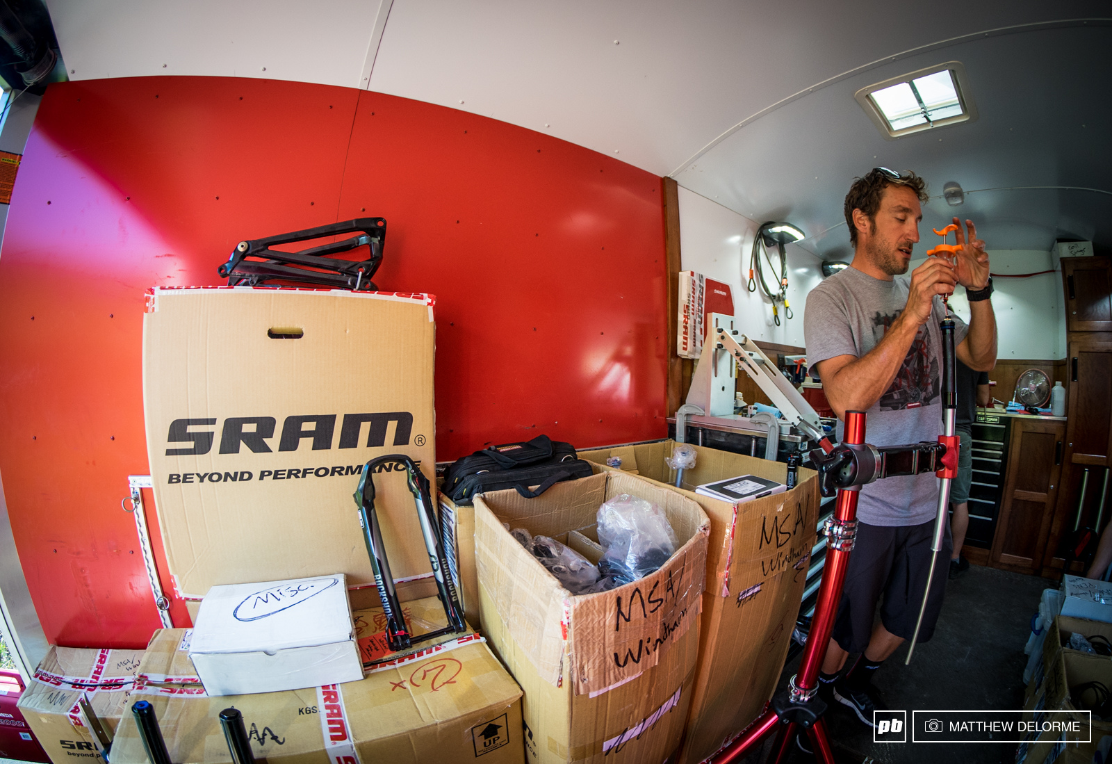 SRAM's Jon Cancellier making sure suspensions are dialed before the first day of practice.