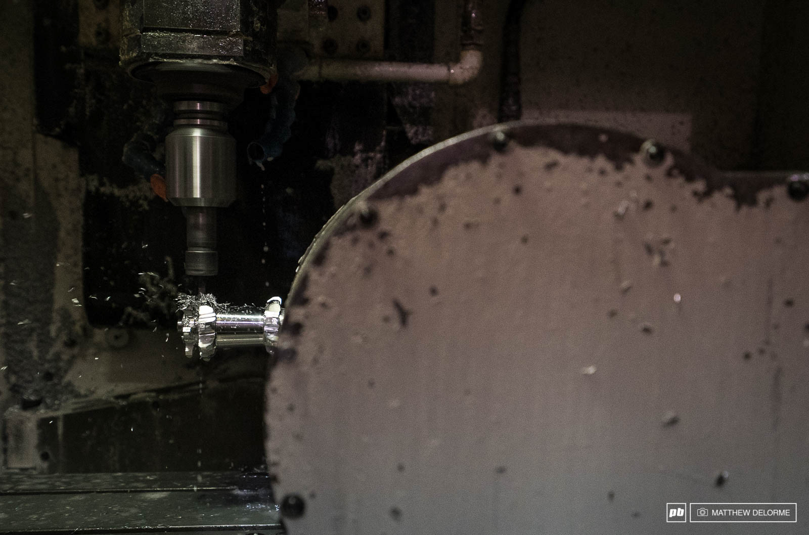 Next, spoke mount posts are milled out in a five axis milling machine.