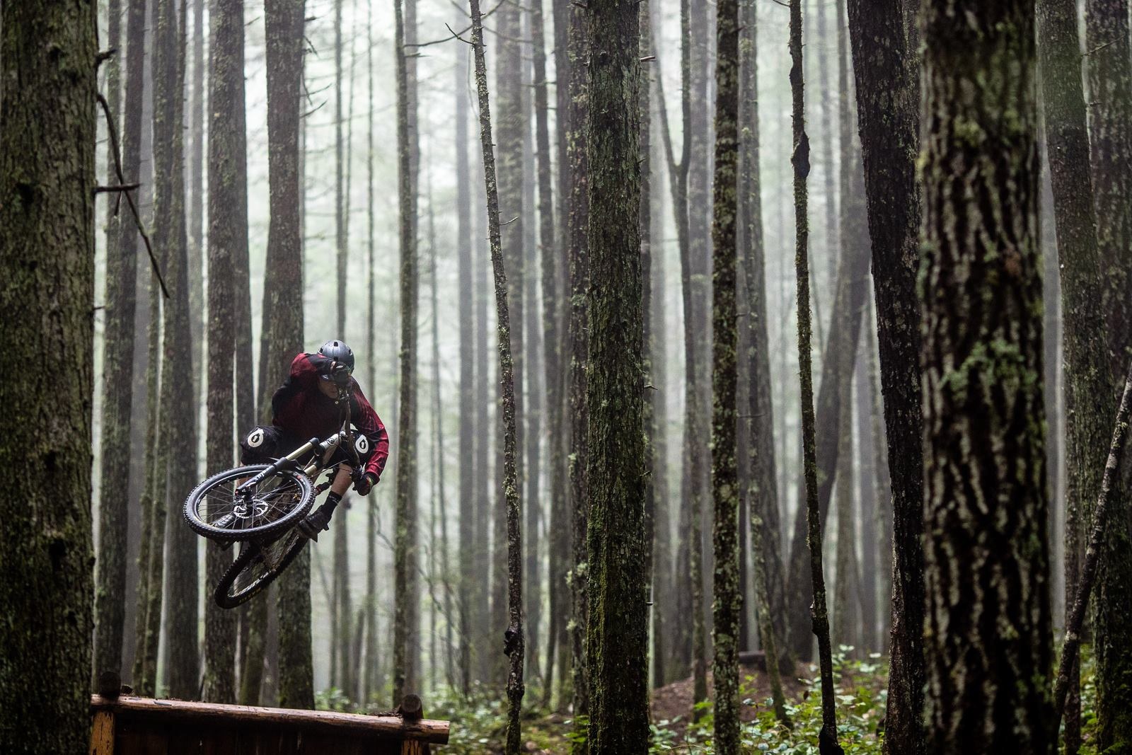 Mountain biker jumping in the rain