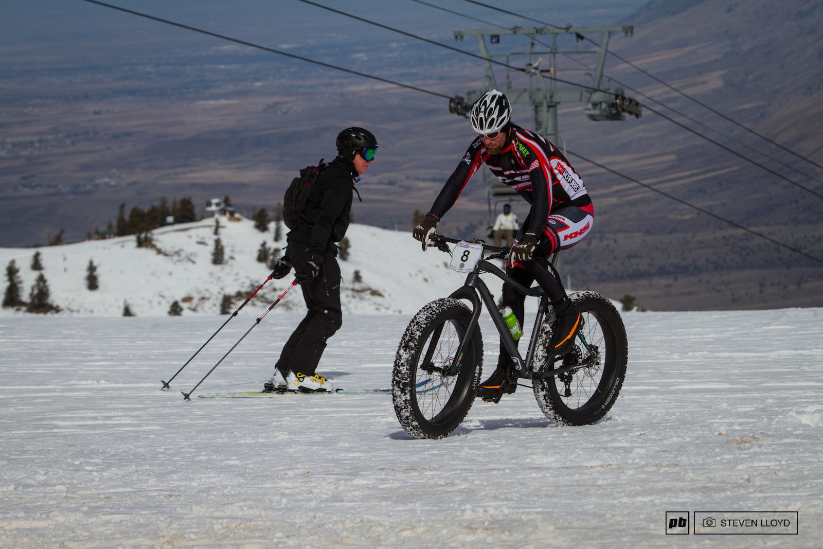 Skiers and bikers shareing the slopes.