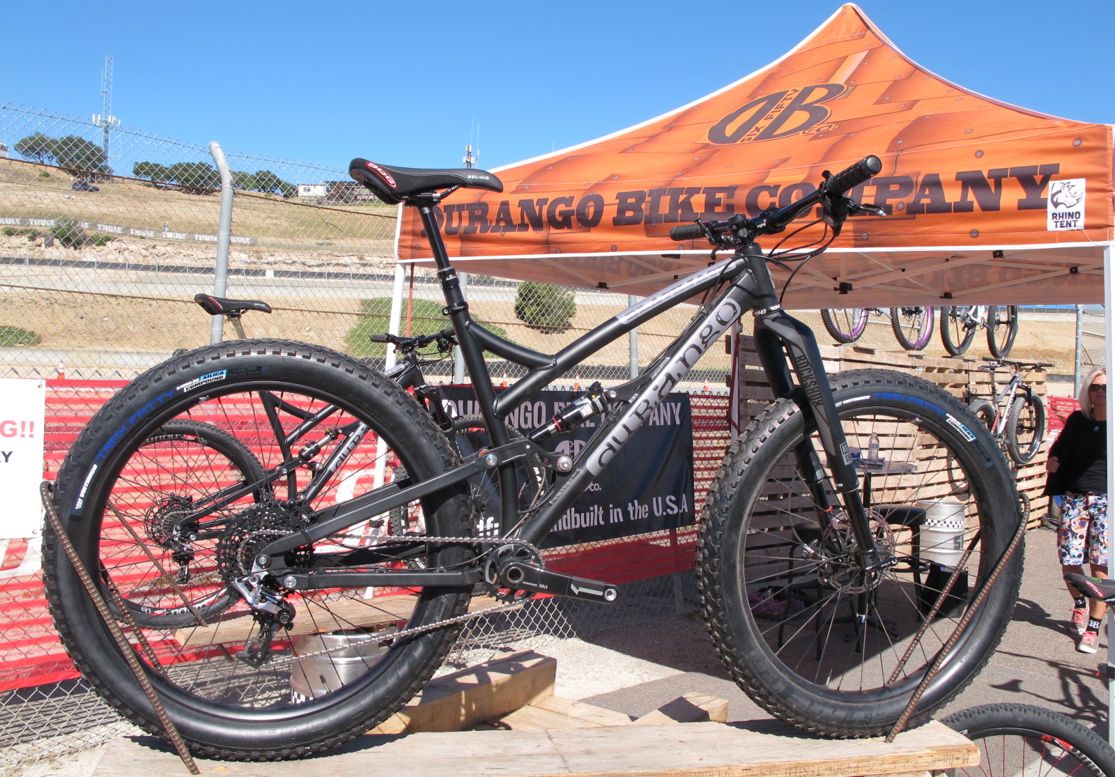 This is the Black Jack from Durango Bike Company. It's a 29er frame that is currently shod with a 650B + wheel set up. The rear end is set to 120mm of travel via a modified Horst Linkage.

The entire frame is made in the USA, from the tubes, billeting and even the rear axle on the 148mm hub. You'll find over sized Enduro brand bearings at all the pivots too. Add in the 16.7" seat stays, 67.5 degree head angle and this bike is made to last and to really get the most out of your trail riding experience.
