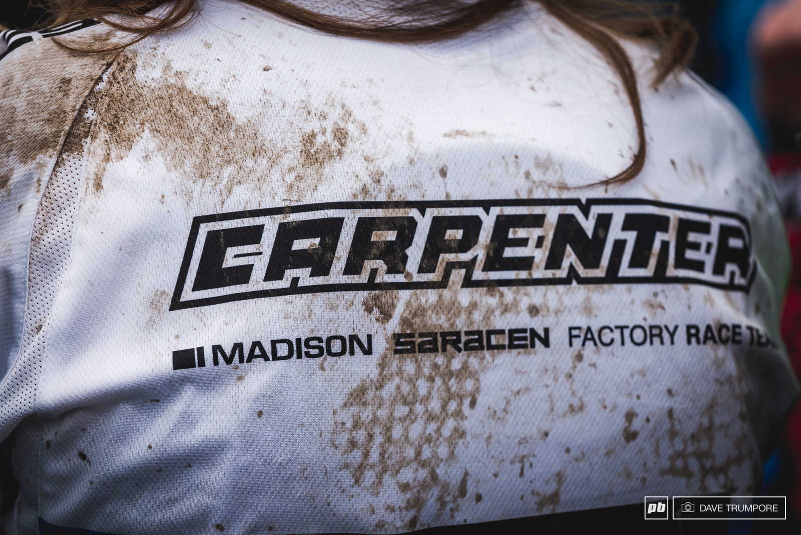 The dirt on the back of the jersey tells the tale of the day for Manon Carpenter who took a scary slam off the final jump just meters from the finish arena.