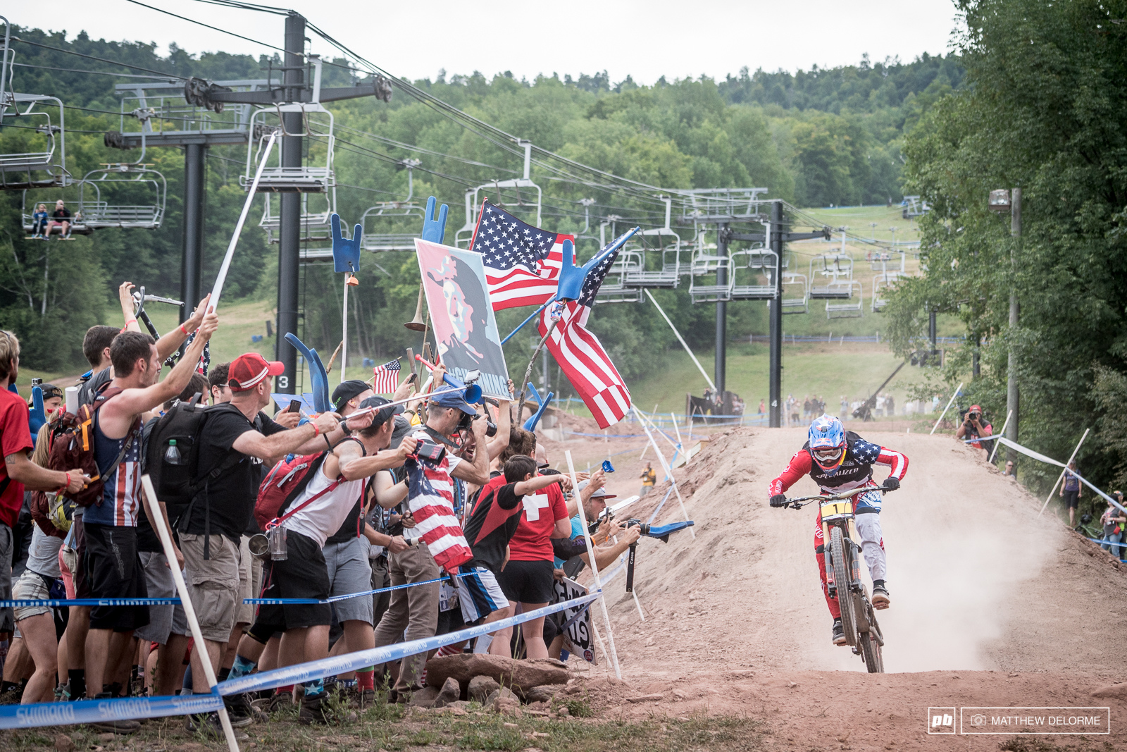 The home crowd cheering Gwin in as he stares down the finish line.