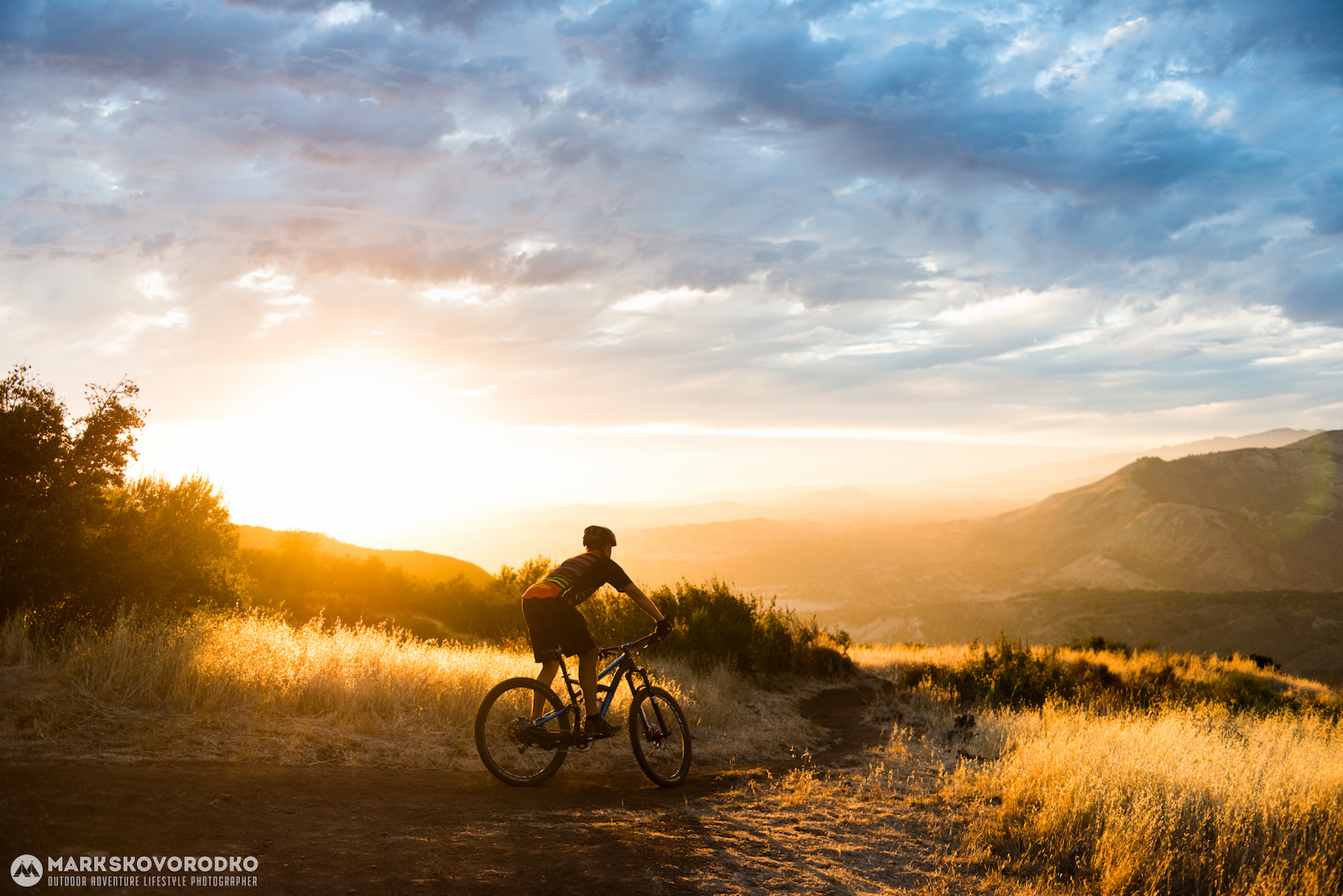 Filipp Kozachuk descends Snyder Trail a.k.a. Knapp s in the backcountry of Santa Barbara California as the sun sets over the Santa Ynez Valley.
