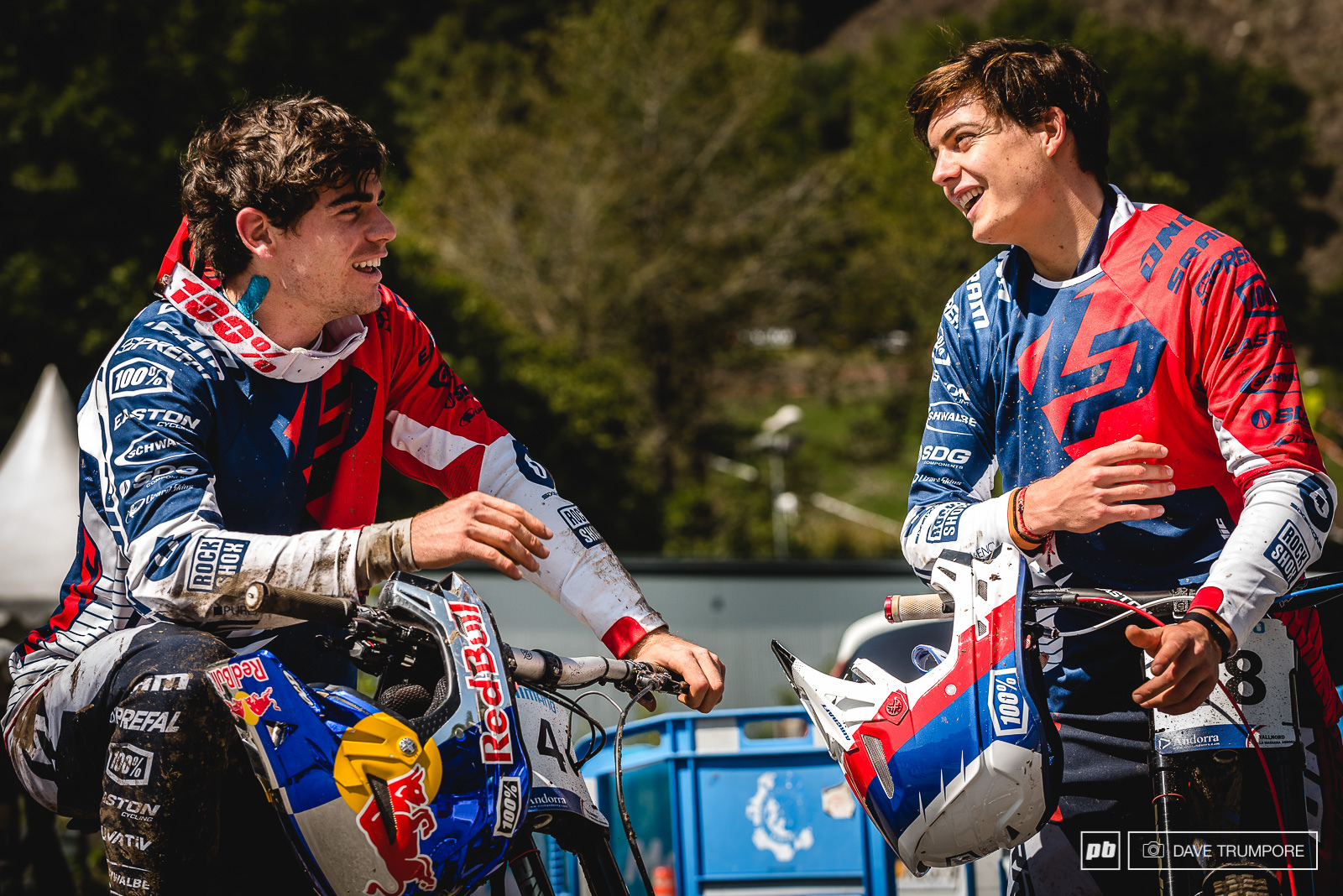 Loic and Loris trading battle stores after a muddy training session in Andorra.