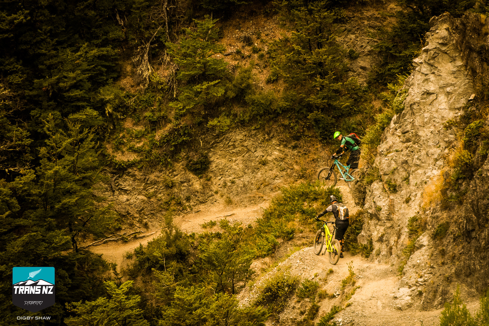 Riders walking an exposed section of The Edge
