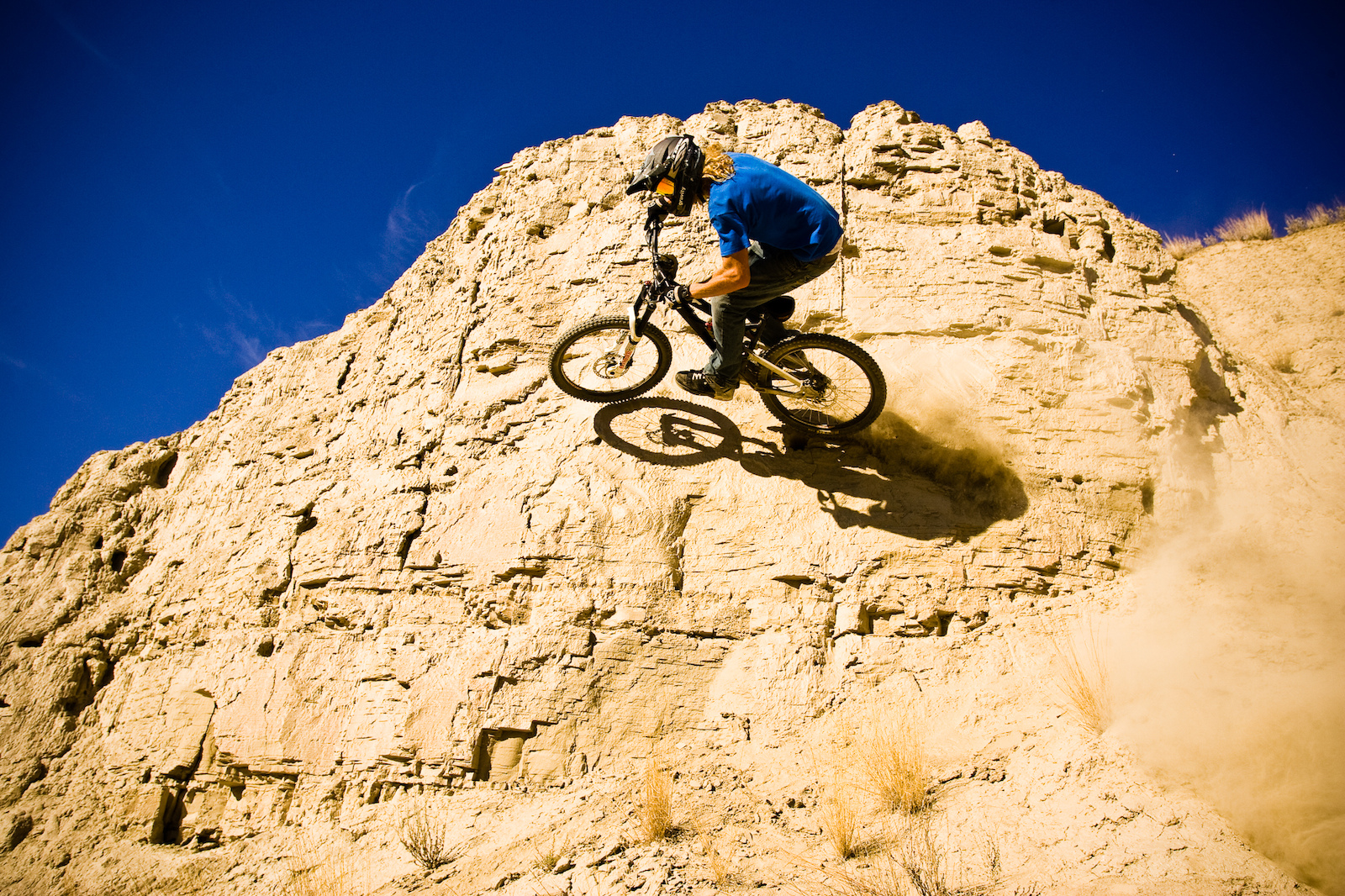Kelly McGarry rides a natural rock wallride on his mountain bike in Kamloops BC Canada Photo Dan Barham