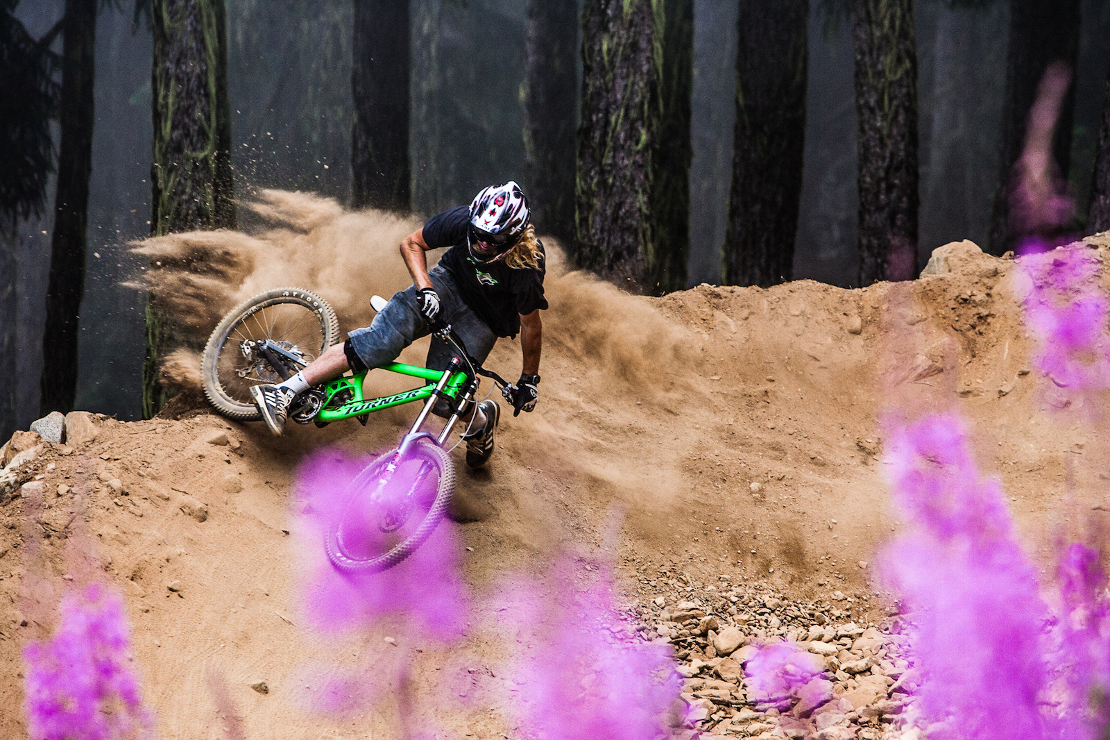 Kelly McGarry creates a dust cloud by aggressively cornering his mountain bike in Whistler Bike Park Whistler BC Photo Dan Barham
