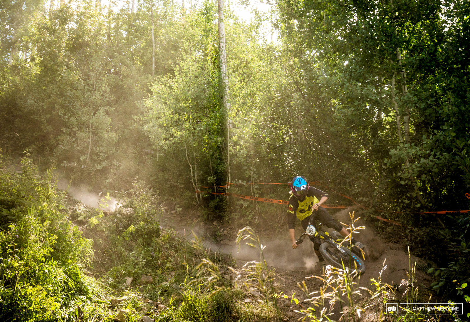 Ray Syron slides into the loose catch berm at the bottom of the drop filled stage six.