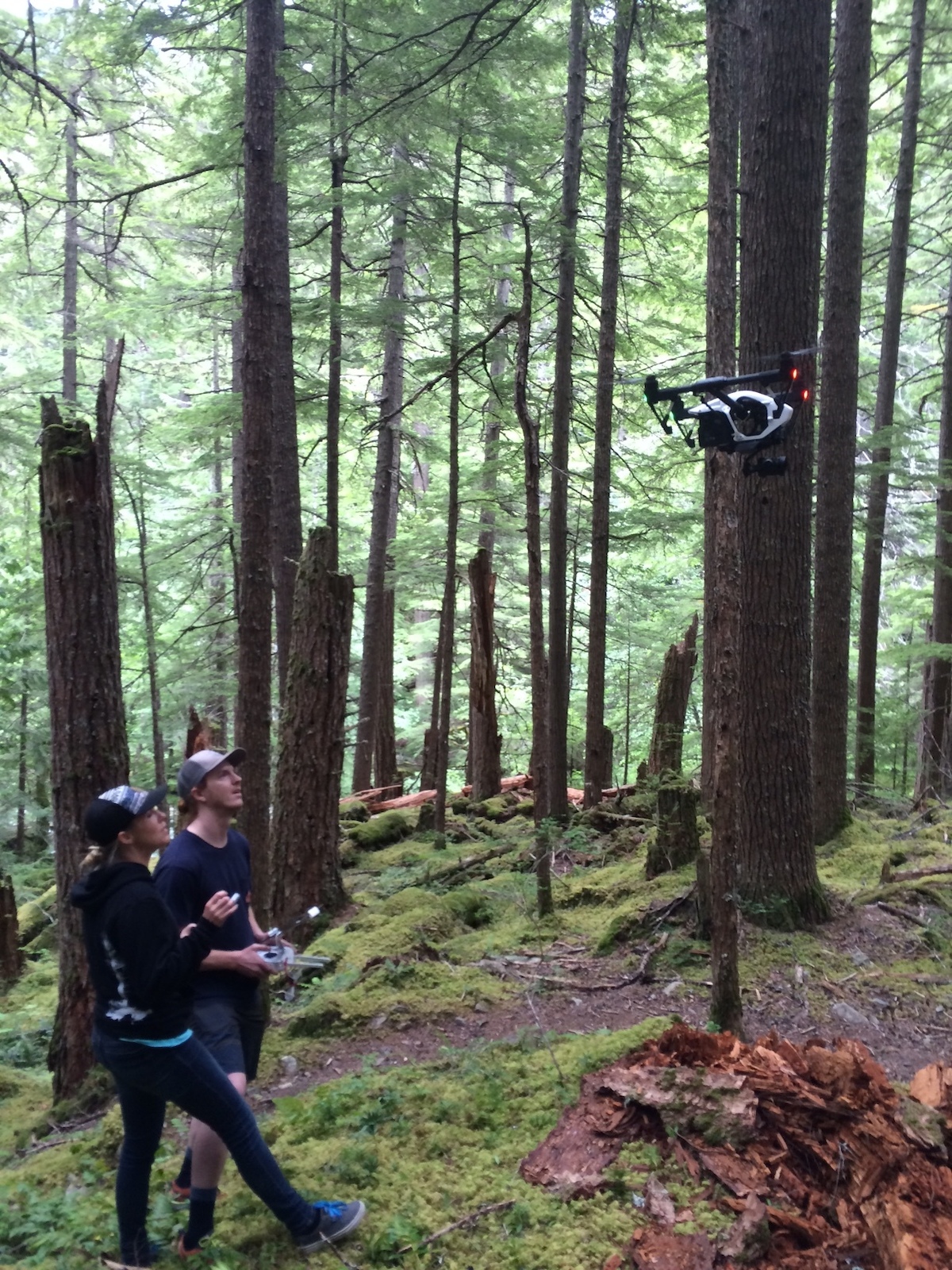 Lacy and Garret bring the drone in for a landing.