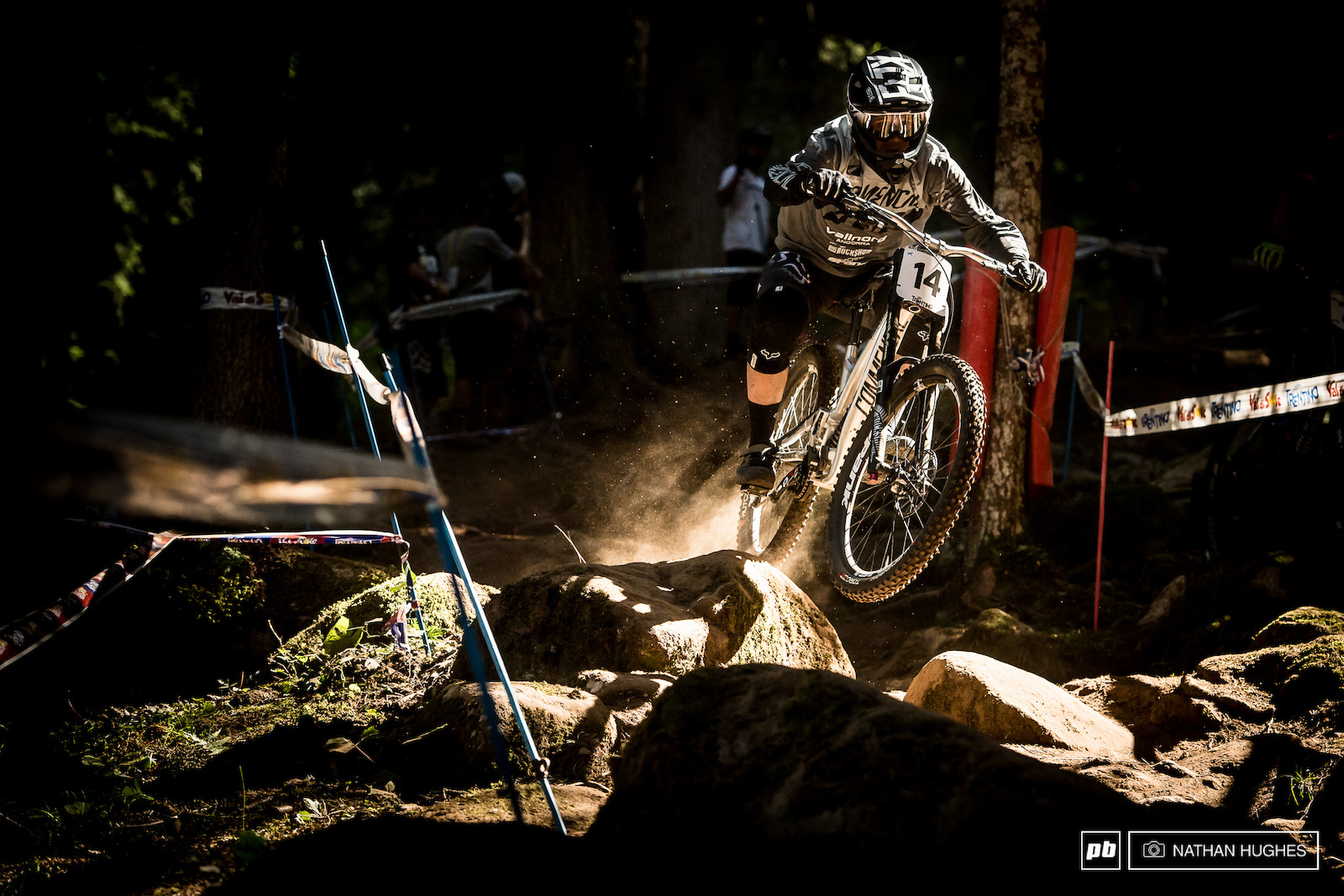 Brannigan hurtling through beams of light in the forest.