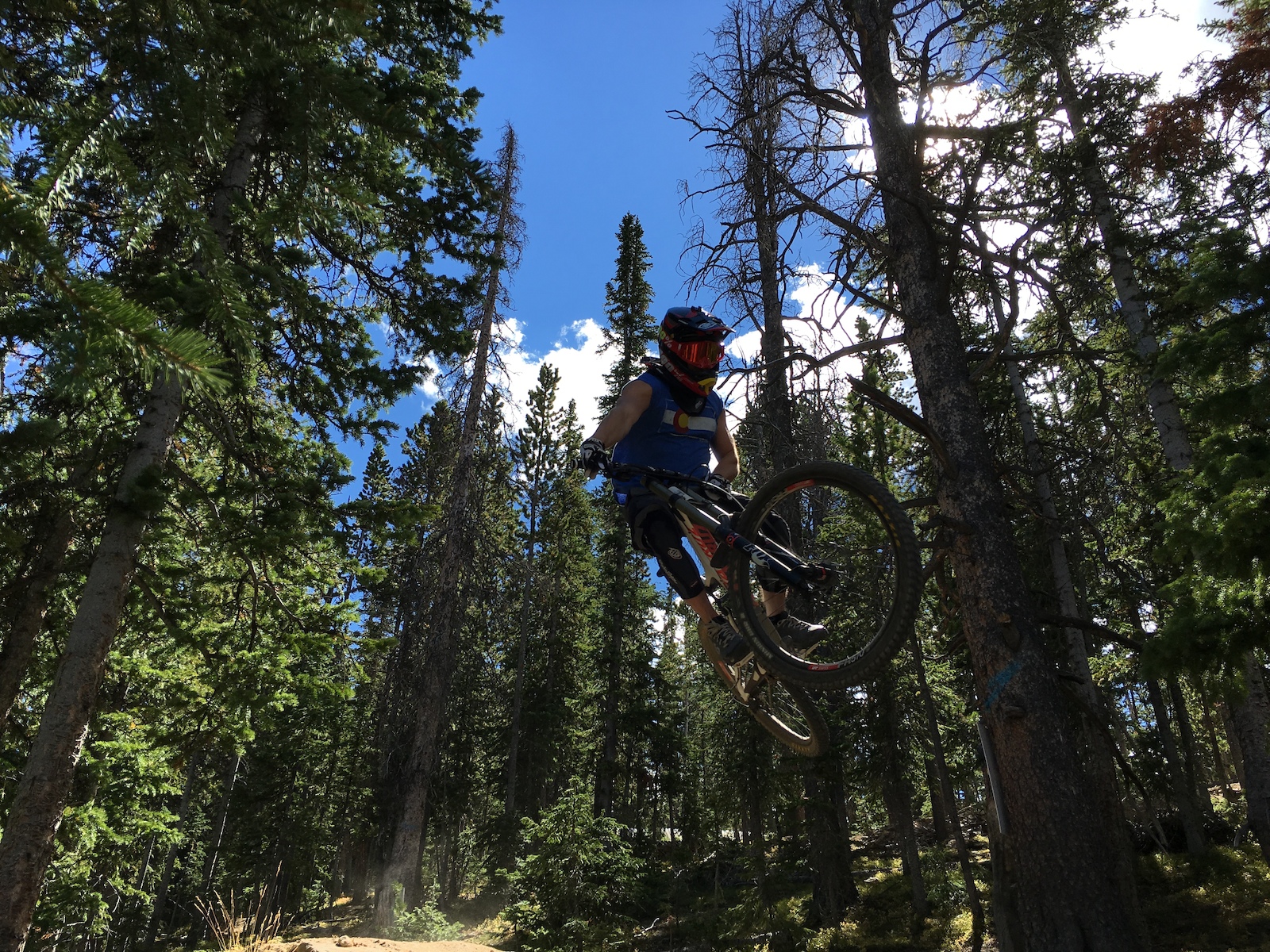 Close up shot on the last jump after the wood on the trail