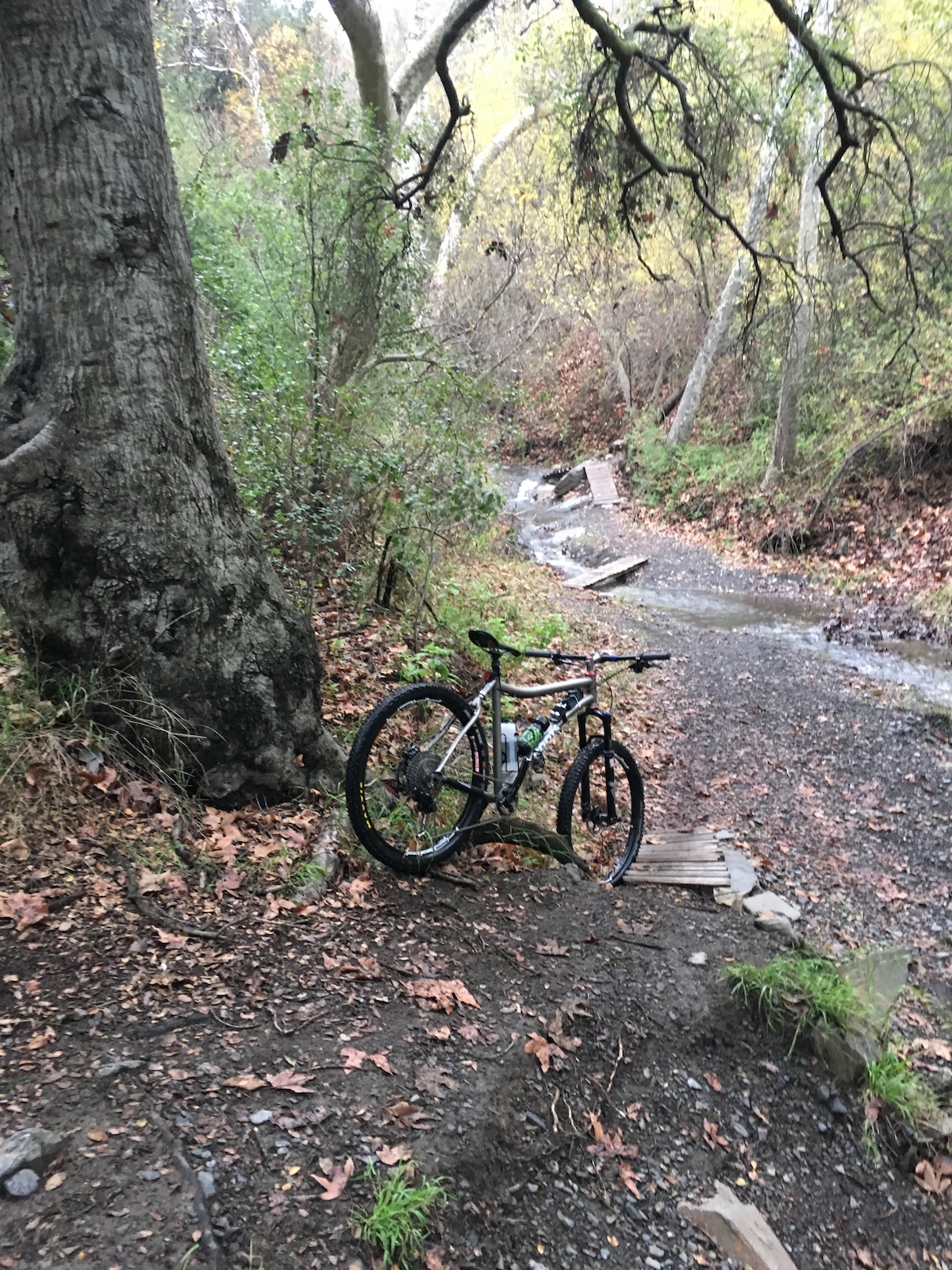 A ride through Nature's Playgorund in Southern California. This was taken in the Santa Monica Mountains in Sullivan Canyon mid winter. 
Bike in picture:
Moots Rogue Ybb 
Shimano XT Drivetrain 1x11 
Shimano XT Brakes
Moots TI Stem
Enve Sweep bars
Chris King Headset
Stans Arch Mk3 Wheelset
Rock Shox Reba Fork 120mm
Tires: 
Frt: Schwalbe Nobby Nic 2.35
R: Maxxis Ardent Race 2.2
KS Lev Dropper
Fabric Shallow Race Saddle
One Up Cassette Expander 50 Tooth
XT Trail Pedals