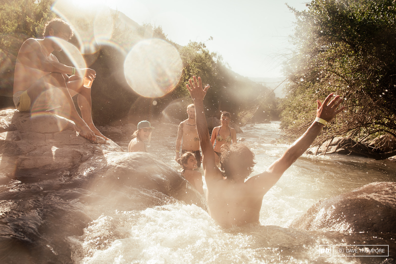 Iago Garay and friends enjoy some cold beers and natural waterslides next to the campsite as they unwind at the end of a very long day.