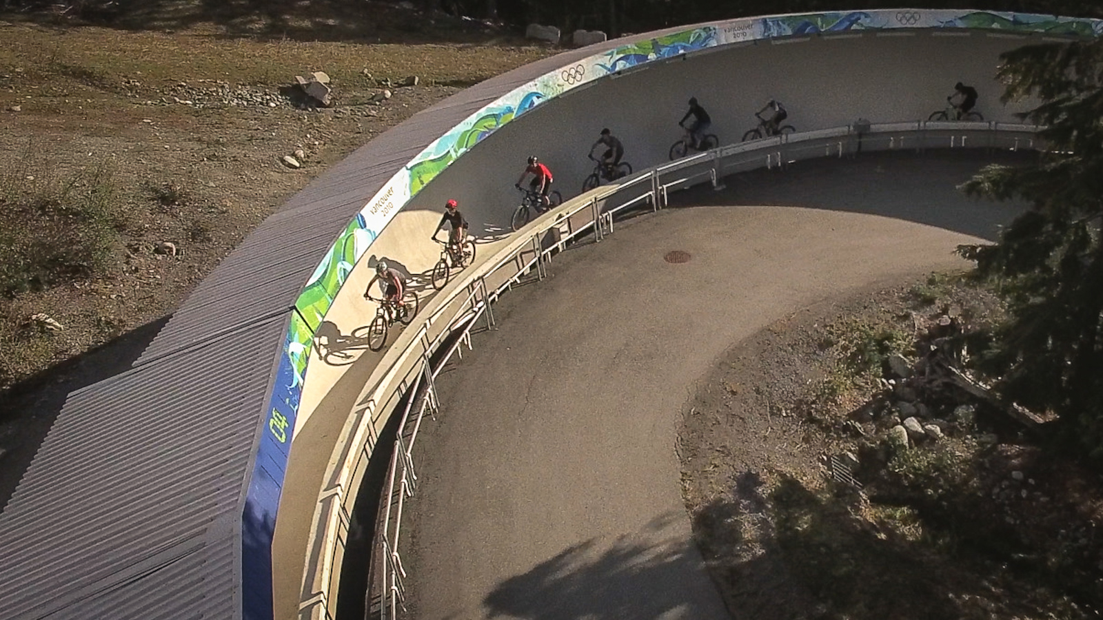 Even the climbs are interesting at the weekly Toonie rides in Whistler. Here riders ascend the bobsled track from the 2010 Vancouver Olympics on their way to Golden Boner.