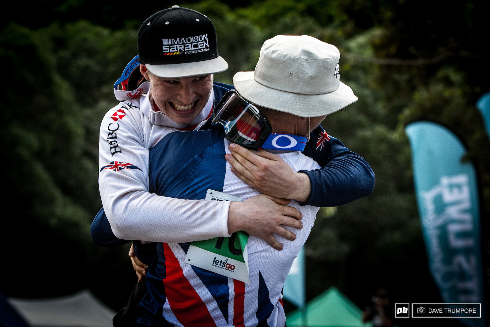 Kaos Seagrave hoists up a very happy Matt Walker as he clinched the junior world title.