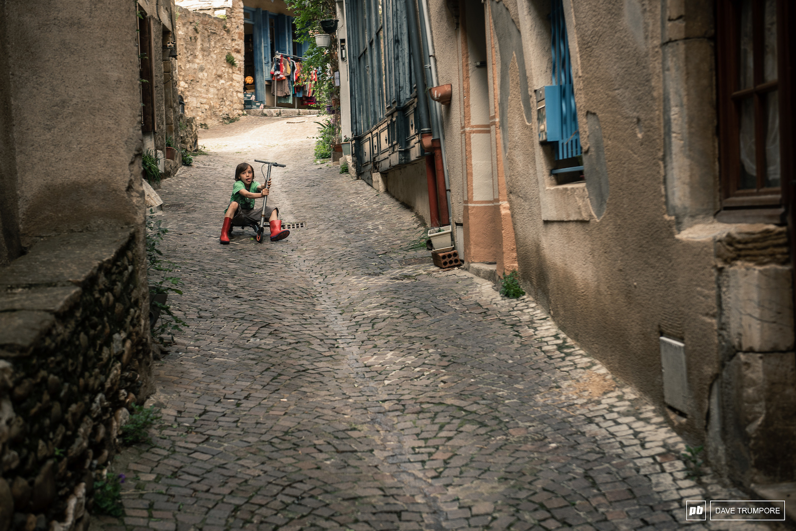 The locals are already out testing the fast lines for Stage 4 through the streets of Olargues.