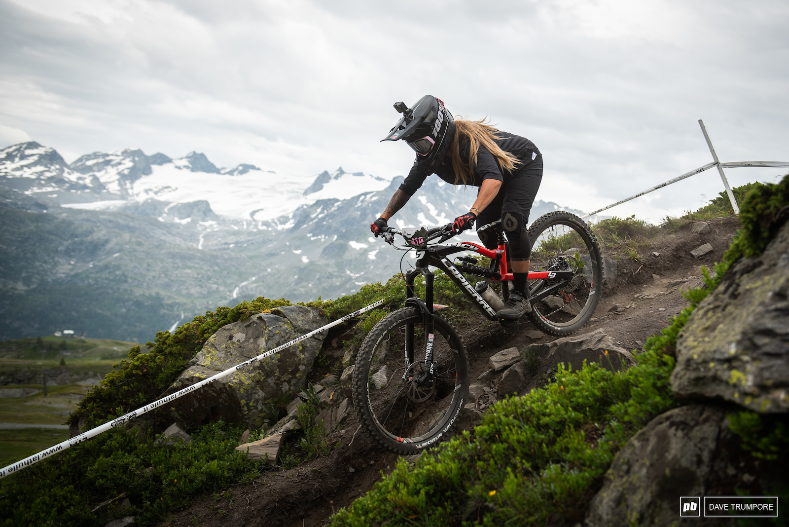 Chloe Gallean drops in to Stage 6 as the clouds begin to build over the Alps.
