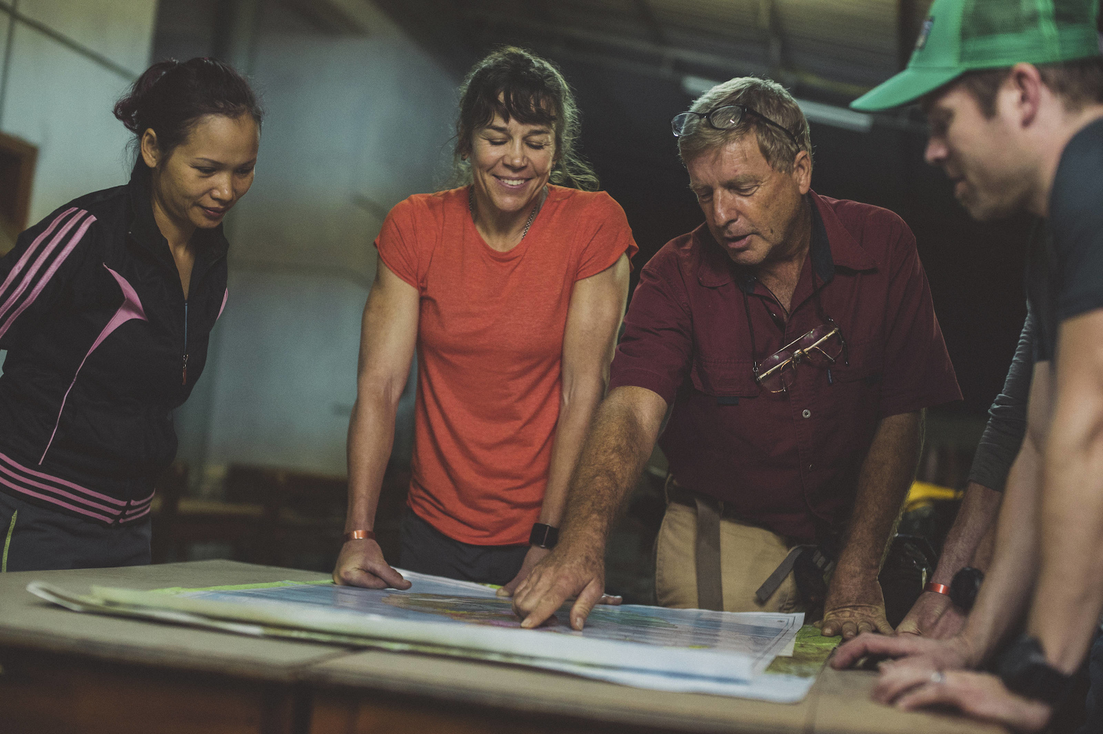 Huyen Nguyen, Rebecca Rusch, and crew members study the map along the Ho Chi Minh Trail for the feature film project 'Blood Road' in Vietnam, Laos, and Cambodia in March, 2015. // Josh Letchworth/Red Bull Content Pool // AP-1UD72NRX51W11 // Usage for editorial use only // Please go to www.redbullcontentpool.com for further information. //