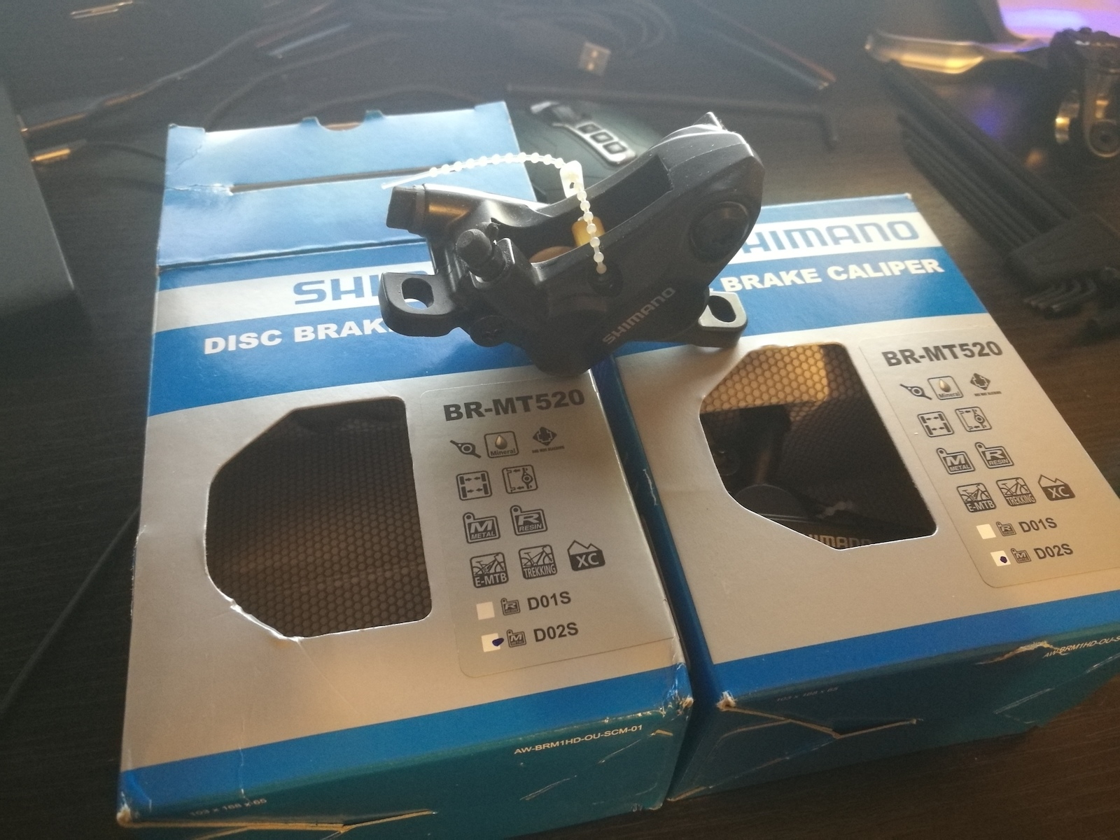 Shimano BR-MT520 4 piston calipers.
same size ceramic pistons as BR-M820.
Direct mount brake hose and one-way oil route. Only $35 with mounting hardwares and metal brake pads. Really worthy item.