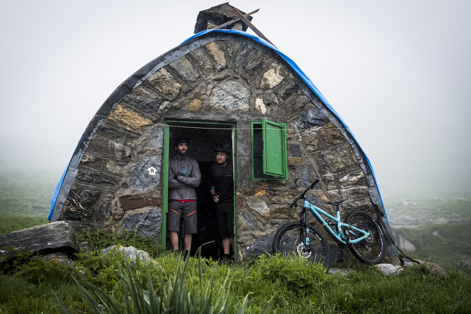 Rafa and Pablo wait for the rain to ease before a 700 metre push up to the Sierra Negra trail.