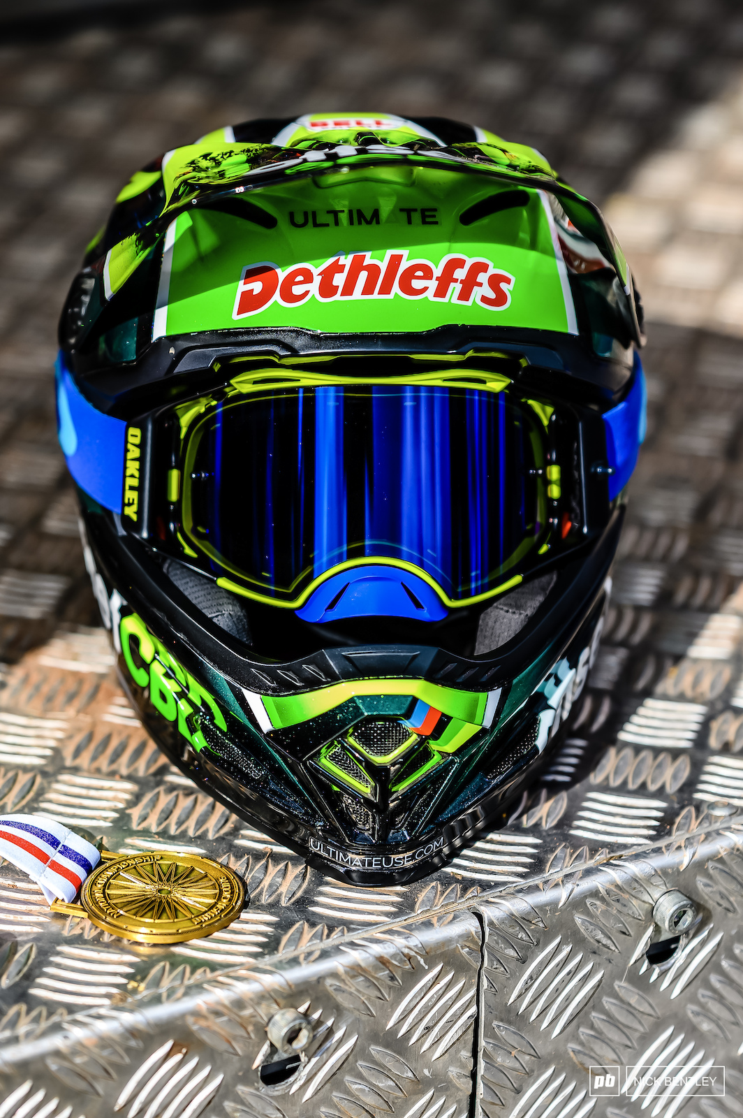 It s not everyday you see a National Championships Gold medal just chilling out on the podium with a custom painted Bell helmet. These both belonged to the Men s winner Scott Baumount.