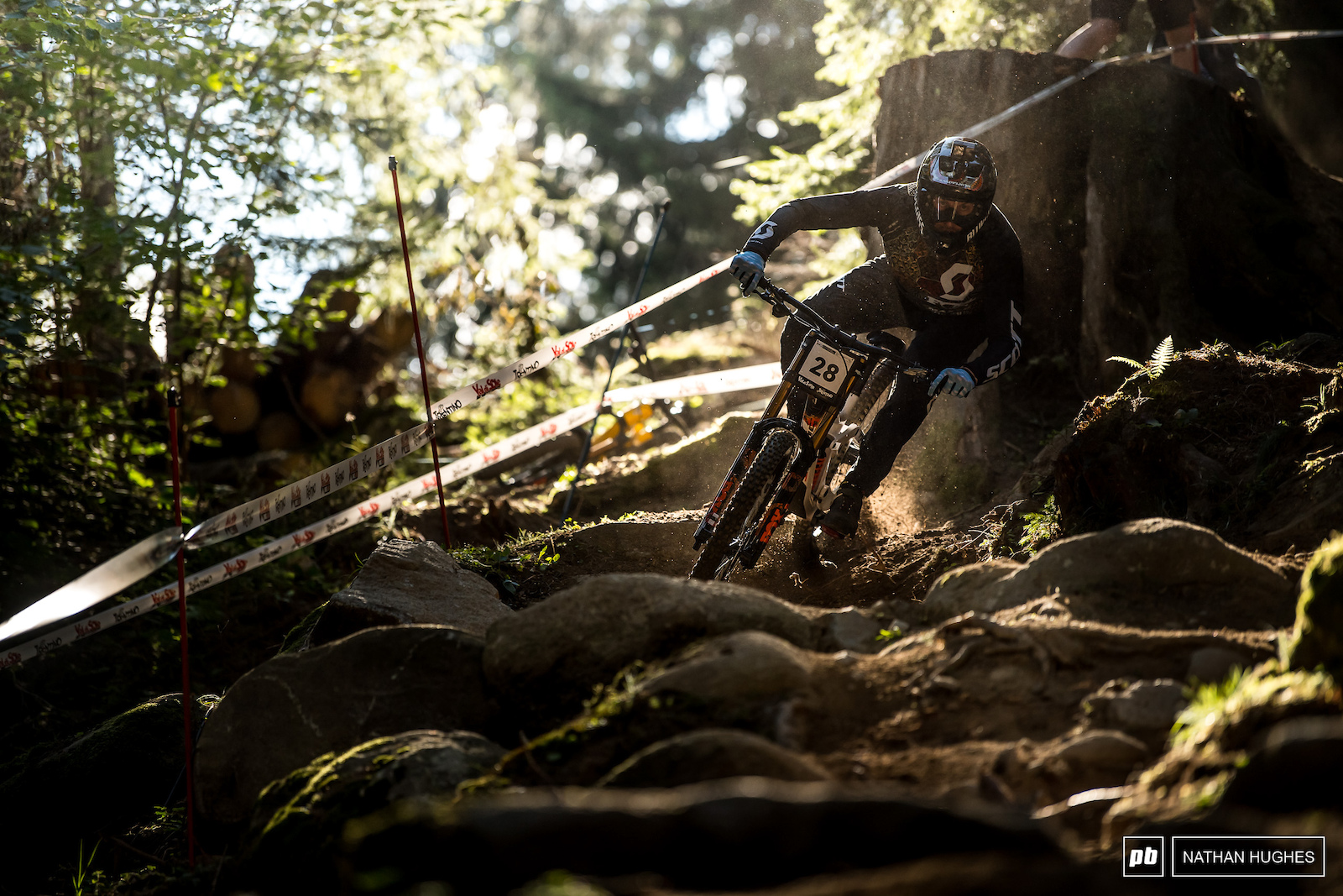 Lucas finding his line through the brown pow and boulders.