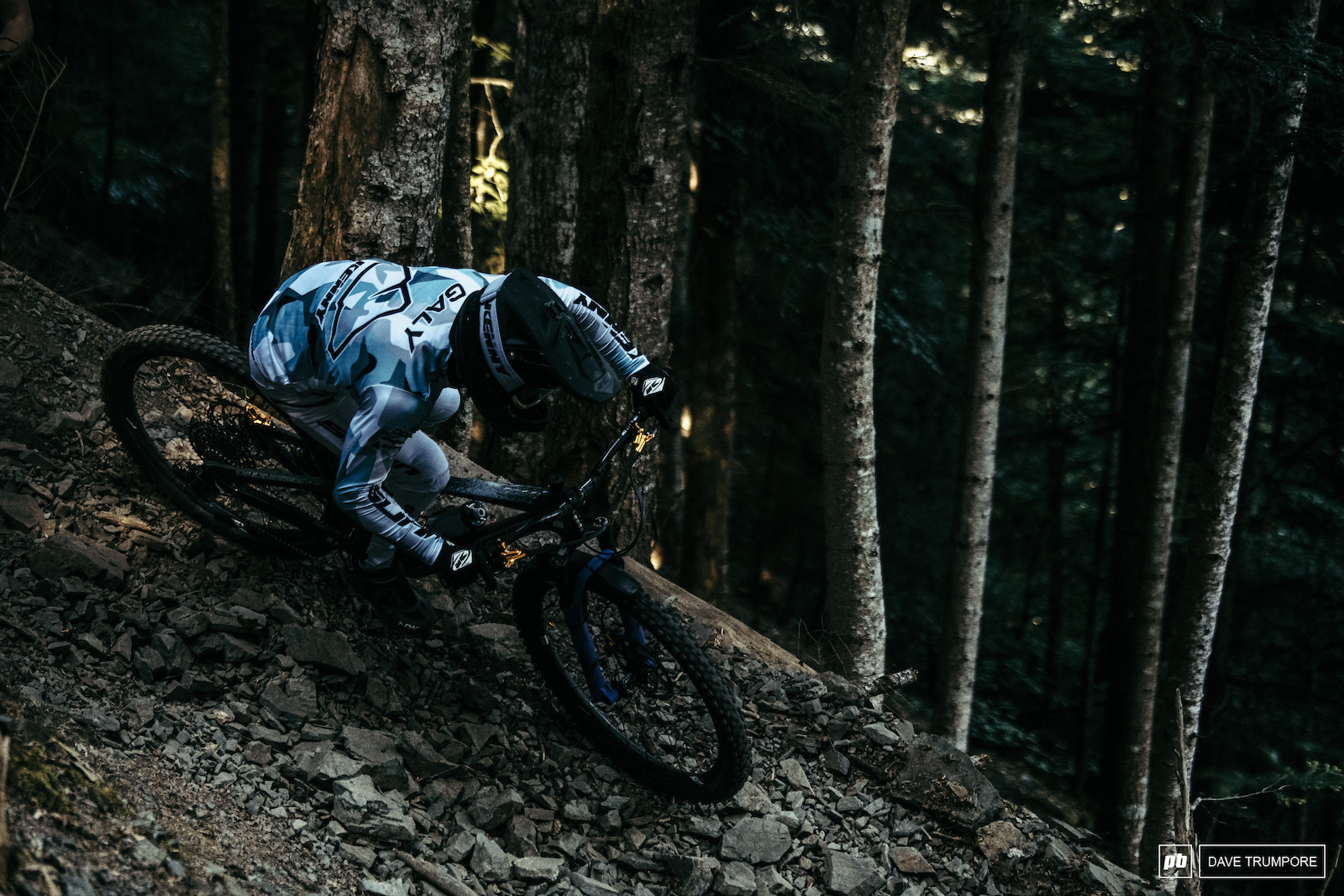 Theo Galy trying to find grip on the ever shifting rocks in the woods