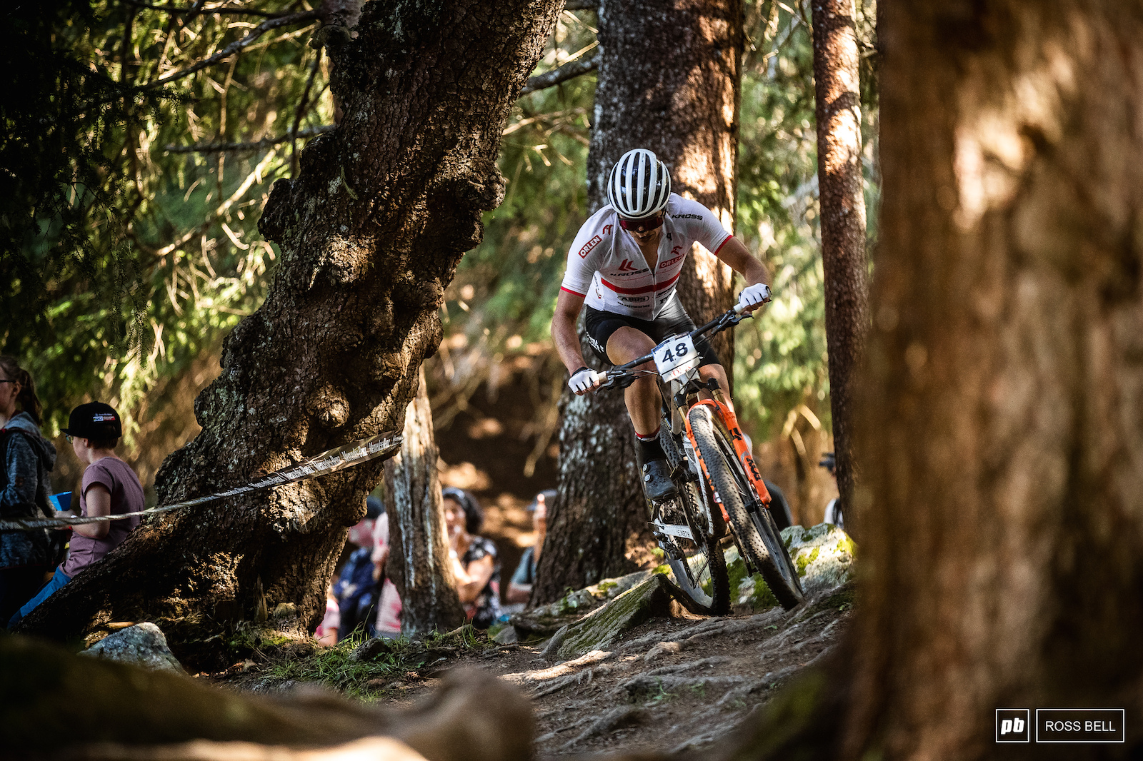 Bartlomiej Wawak cutting through the trees on the far ned of the course.