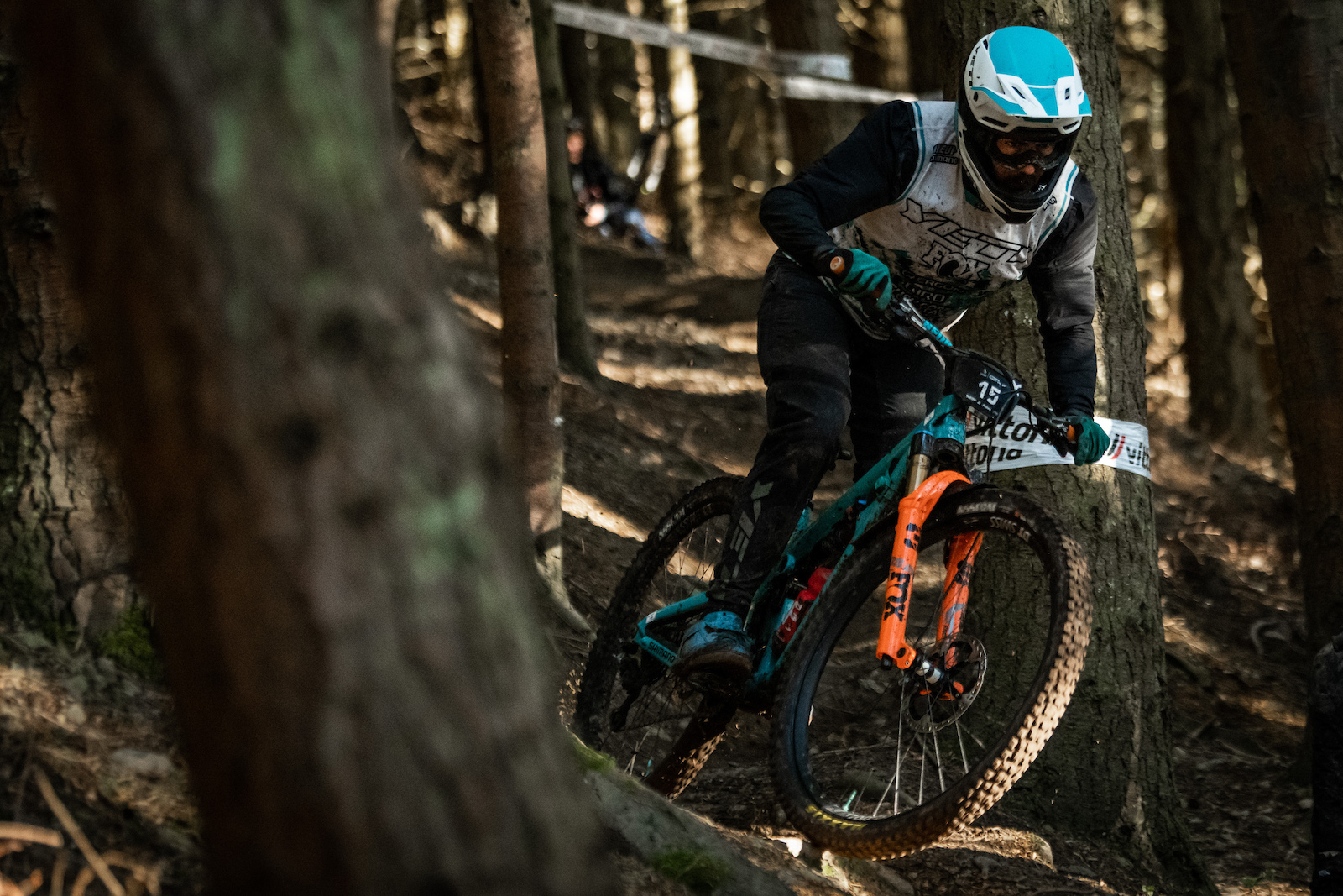 Shawn Neer through the trees on Stage 6