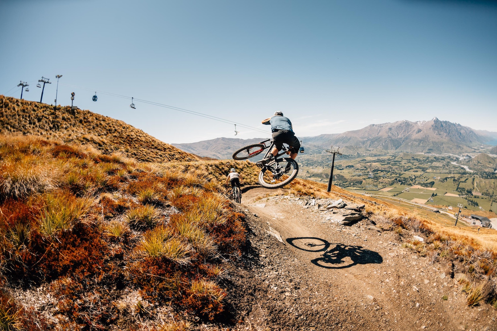 Conor with a table whilst the Remarkables and lift line watch on.