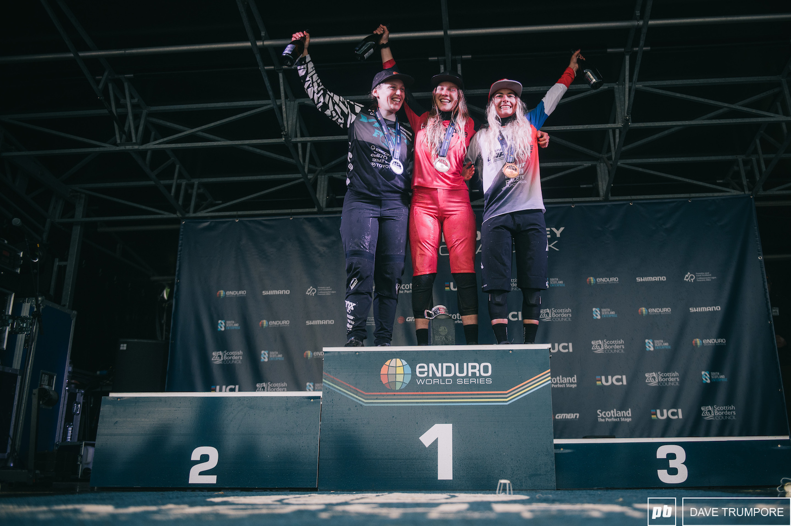 Ella Conolly flanked by Bex Baraona and Isabeau Courdurier on the women s podium.