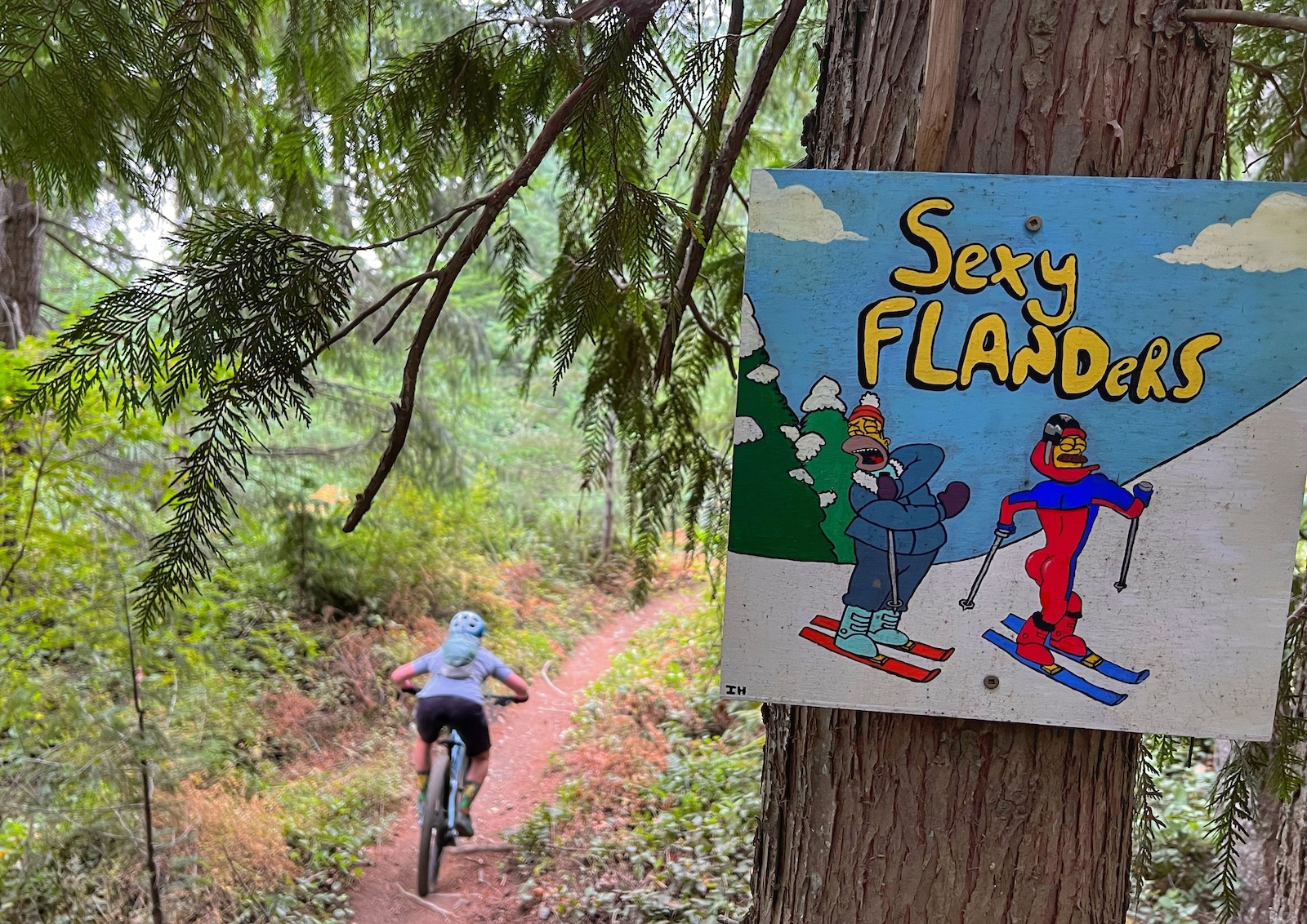 Sign with "Sexy Flanders" showing the entrance to a mountain bike trail in south nanaimo