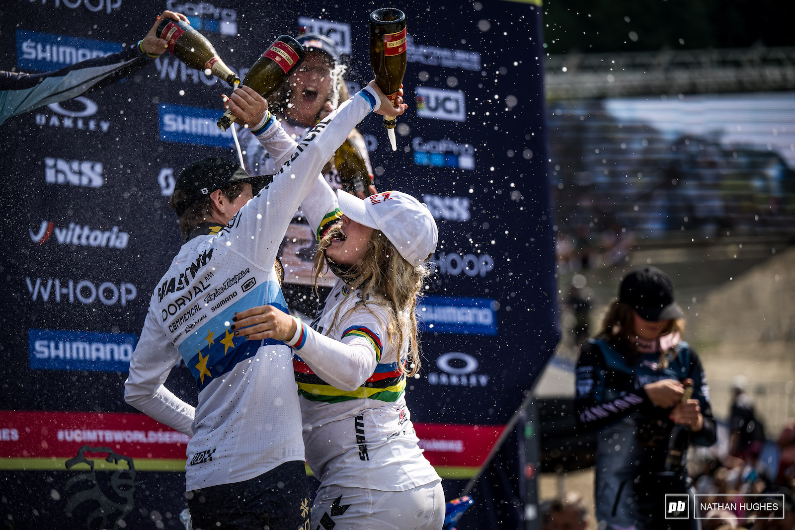 Champagne showers for one and all on the podium.
