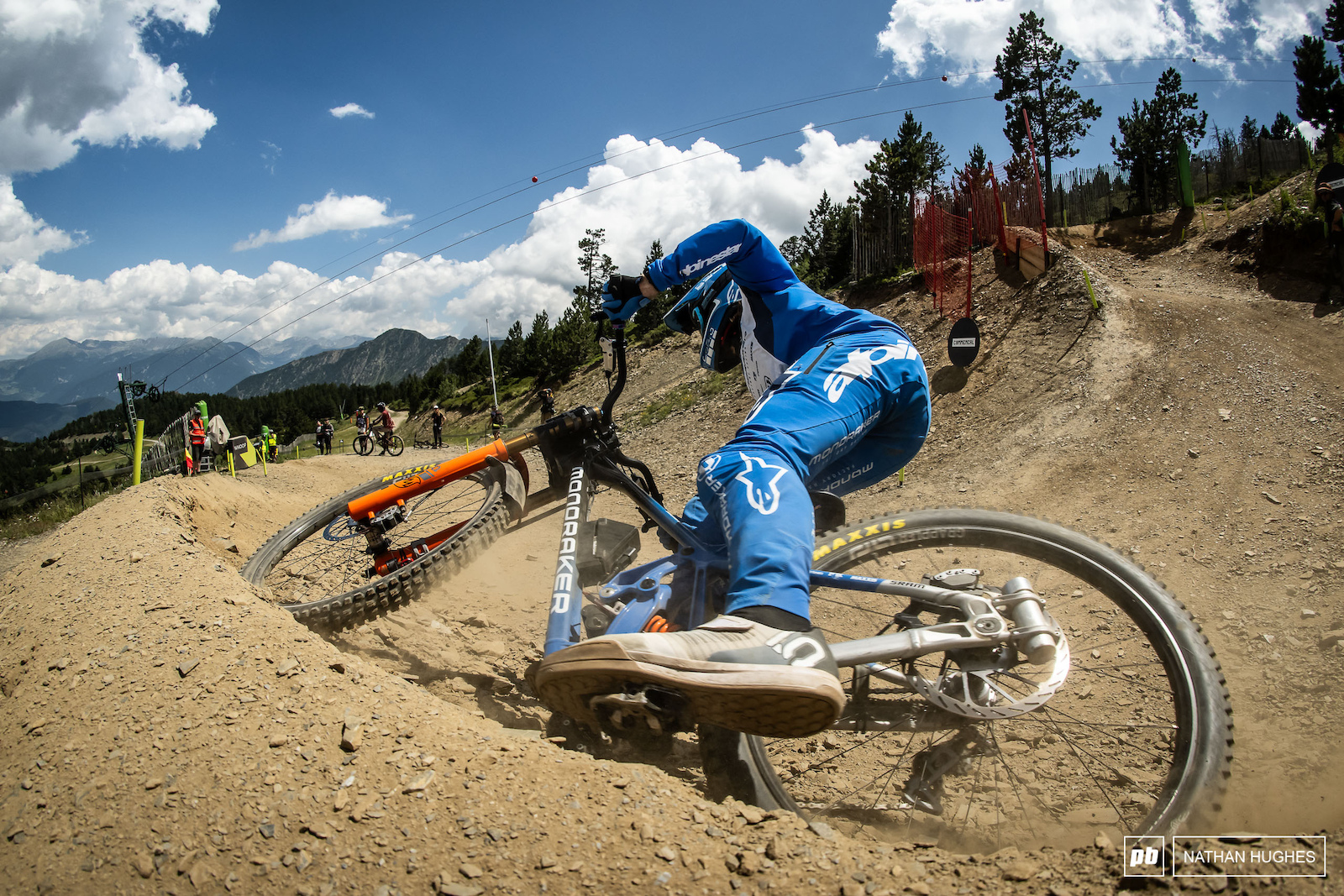 Dakotah Norton gripping and ripping the Mondraker through the roughed up berms.